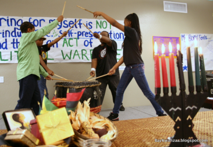 A Group Performs An African Drum Song During A Kwanzaa Celebration